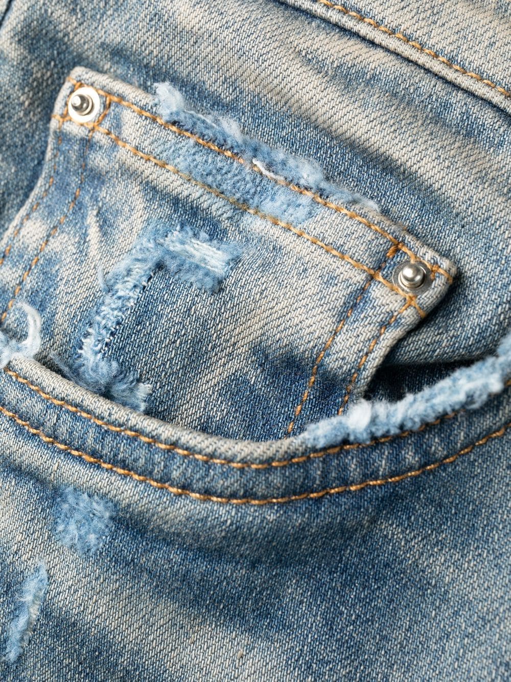 Jean skinny à logo cousu en cuir AMIRI