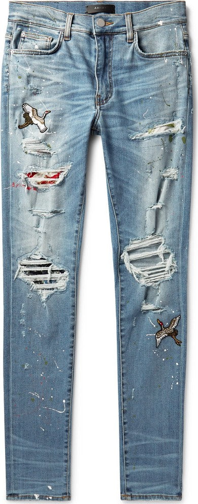 Jean skinny en denim stretch effet vieilli et éclaboussé de peinture AMIRI