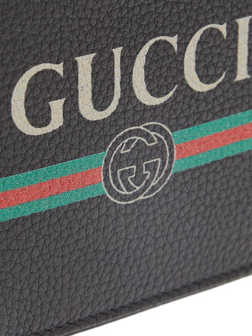 Cartera plegable de piel con estampado Gucci para hombre